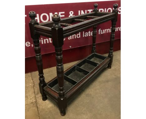 A Victorian oak and cast iron stick stand 