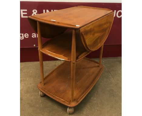 An Ercol Blonde elm and beech Windsor drop-leaf trolley 