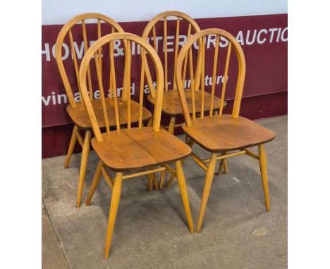 A set of four Ercol Blonde elm and beech Windsor chairs 
