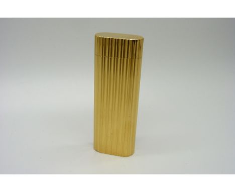 A Cartier gold plated cigarette lighter 