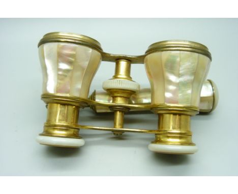 A pair of mother of pearl opera glasses with handle 