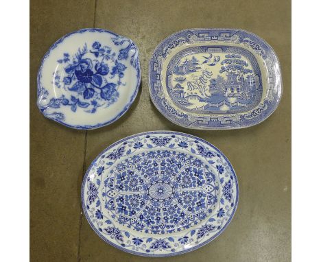 A blue and white early stoneware Willow pattern meat platter with well, a/f, a Thomas Booth blue and white Indian ornament ov