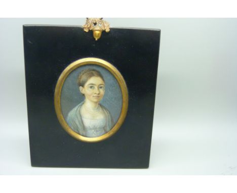 A 19th Century portrait miniature on card, in an ebonised frame with acorn hanger 