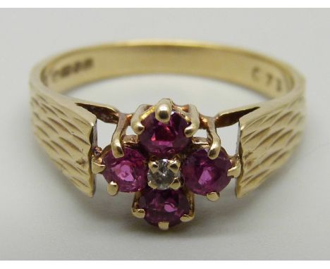 A 9ct gold, ruby and diamond cluster ring, 2.6g, N 