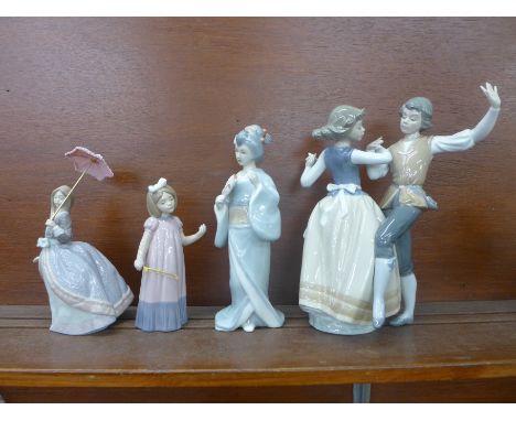 Two Lladro figures including Dancing the Polka, one Nao and one other 