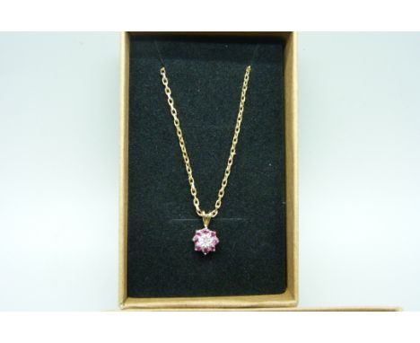 A 9ct gold ruby and diamond pendant and chain, 3.3g 