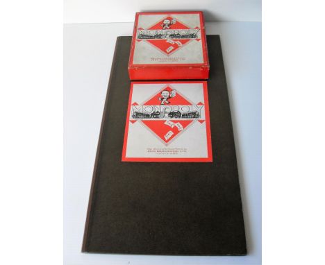 A 1940s unboxed John Waddington Ltd. Monopoly board and set, patent 453689 in good condition with a two-deck Kaiser Jubilee I