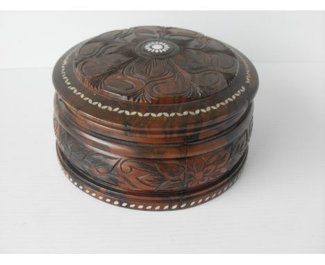 An Oriental rosewood and mother-of-pearl decorated circular box with hinged lid and fitted interior, 10 x 20 cmCondition: hin