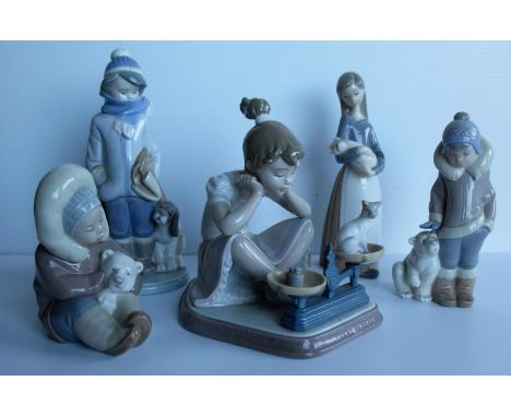 A Lladro seated figurine of a girl with kitten and weighing scales, a seated Eskimo child with bear and one other standing, b