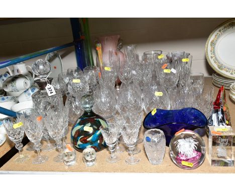 A QUANTITY OF DRINKING GLASSES AND COLOURED GLASSWARE, including cylindrical decanter with silver collar, Mdina style paperwe