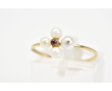 A 9CT GOLD RUBY AND PEARL RING, designed with a central circular cut ruby and cultured seed pearl surround, to the fine polis