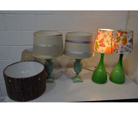 A PAIR OF MID 20TH CENTURY STYLE GREEN GLASS TABLE LAMPS with floral shades, together with a pair of green ceramic table lamp