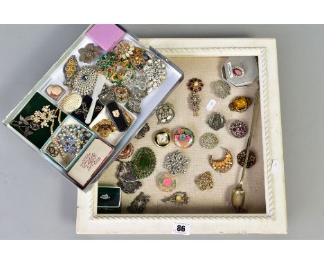 A DISPLAY BOX WITH CONTENTS, the white wooden display box with pin cushion lining, displaying various brooches in forms such 