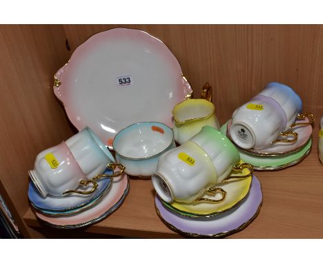A ROYAL ALBERT 'RAINBOW' PATTERN TWENTY ONE PIECE TEA SET, comprising six cups, saucers and tea plates, milk, sugar and bread