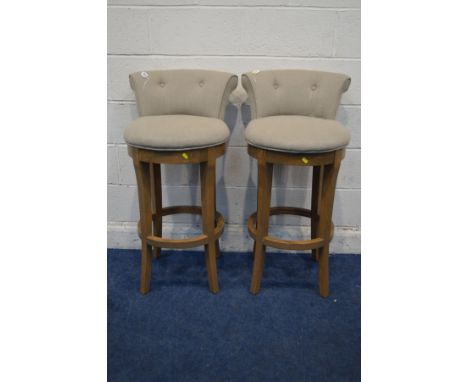 A SET OF THREE MODERN OATMEAL SWIVEL BAR STOOL on a hardwood base (condition: height of stool from floor to seat is 70cm)