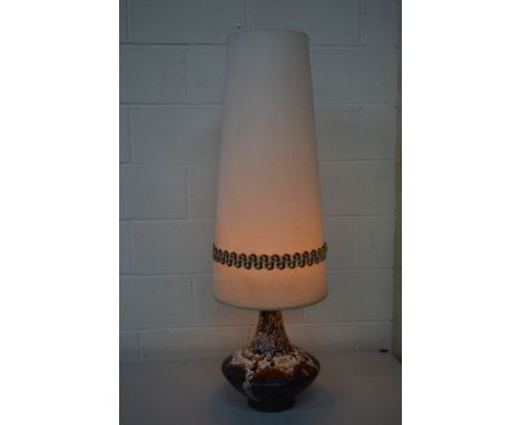 A WEST GERMAN POTTERY TABLE LAMP with a cylindrical tapering fabric shade&nbsp; Condition Report&nbsp; No damage to lamp, ver