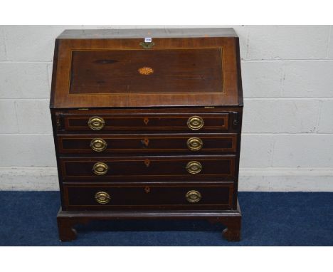 A GEORGIAN MAHOGANY, CROSSBANDED AND STRUNG BUREAU, with a shell inlay to the door, enclosing a fitted interior of various dr