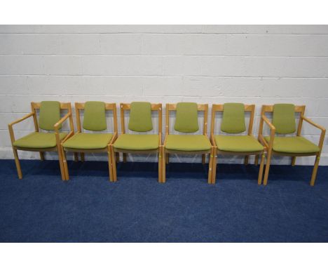 A SET OF SIX ERCOL MODEL 775 AND 775A BEECH FRAMED DINING CHAIRS, with green upholstery including two carvers