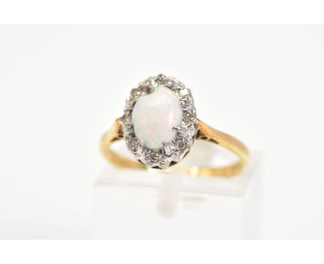 AN 18CT GOLD OPAL AND DIAMOND CLUSTER RING, a claw set central oval cabochon opal, with a single cut diamond surround, to the