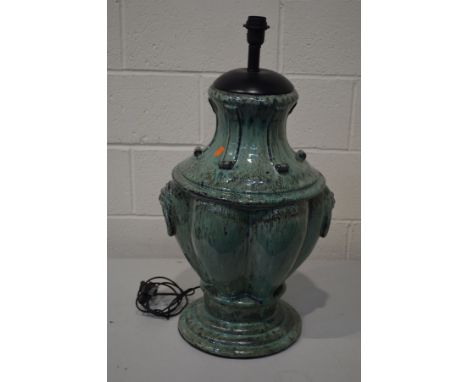 A GREEN GLAZED POTTERY STANDARD LAMP