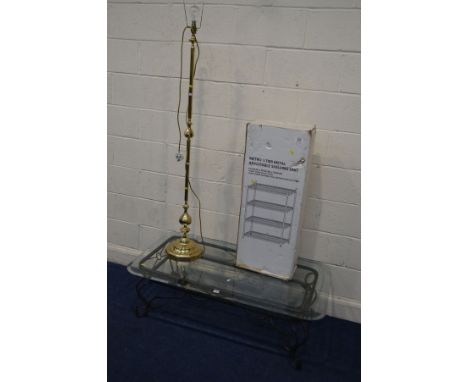 A MODERN GLASS TOPPED WROUGHT IRON COFFEE TABLE together with a brass standard lamp and a boxed chrome five tier shelving uni