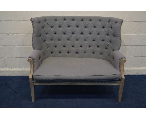 A MODERN STAINED OAK BUTTON BACK LIGHT GRAY TWO SEATER SOFA, with a winged back, width 141cm x depth 78cm x height 115cm (con