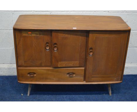 AN ERCOL 1950/60'S BLONDE ELM SIDEBOARD, model 467, with double doors above a single long drawer flanked by a single cupboard