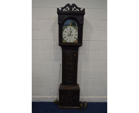 A 19TH CENTURY OAK CASED LONGCASE CLOCK, the hood flanked with carved leaf decorated columns, glazed arched door enclosing a 