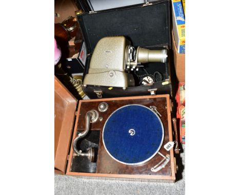 A GRAMOPHONE IN A LEATHER CASING AND CARRY HANDLE, with storage for records, together with a boxed Aldis Projector (2)