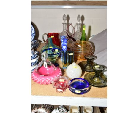 A COLLECTION OF COLOURED GLASSWARE AND A PAIR OF CLEAR GLASS DECANTERS, etc, including a pair of pressed glass chambersticks,