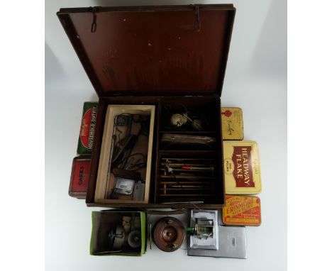 A collection of early fishing tackle including brass and oak reels, boxed Cigna reel, boxed One Arrow double multiplying reel