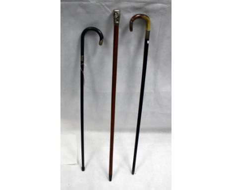 Indian silver mounted walking stick, Burmese silver mounted waking stick and another similar (3)