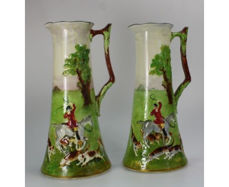 Royal Doulton pair Moorland Ewers decorated all around with painted embossed hunting scenes, height 26cm  (2)