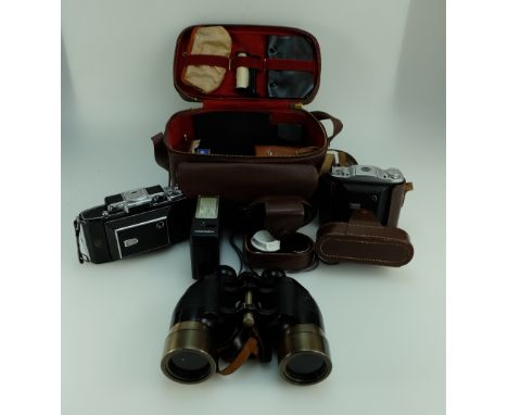 A collection of vintage cameras, binoculars including Zeiss Ikon , Praticka and Ensign