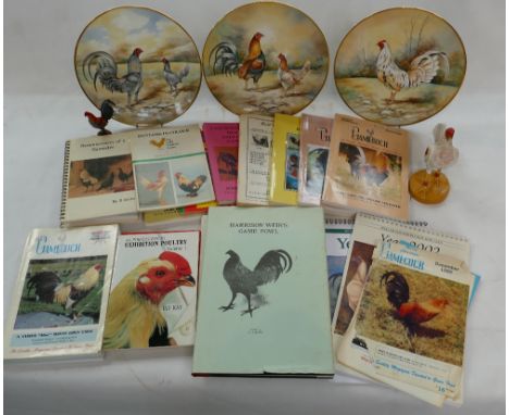 A collection of Cock fighting items to include resin model of fighting cock,  pottery plates, magazines, books of cockerells 