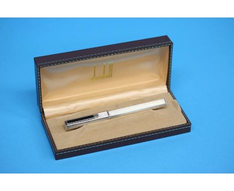 A boxed Dunhill fountain pen, the engine turned body (possibly 925 silver), the nib stamped 750