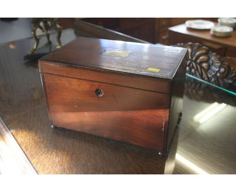 A mahogany tea caddy