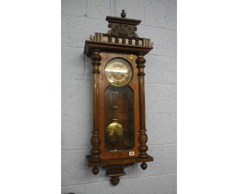 A walnut cased wall clock