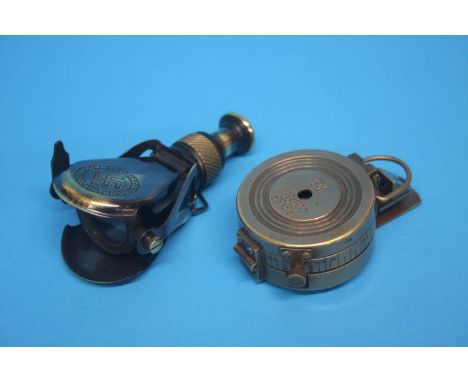 A reproduction German telescope and a 1st World War reproduction compass