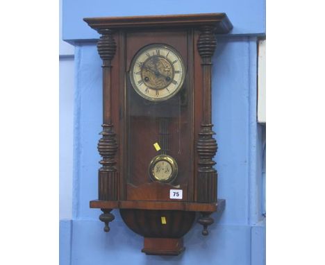 A mahogany wall clock