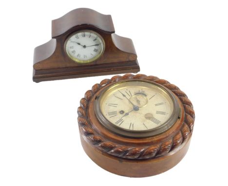An American Ansonia wall clock, with paper dial, the case carved with stylised rope twist, the back bearing label for the man