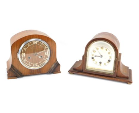 An early 20thC walnut cased mantel clock, dial with brass Arabic numerals, 33cm wide, and another walnut clock, 28cm wide. (A