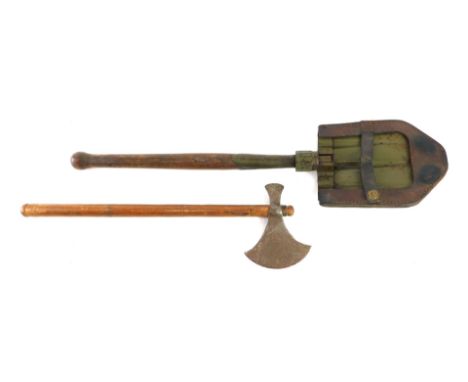 A WWI folding military shovel or entrenching tool, with a canvas and leather scabbard, and an axe with turned wooden handle. 