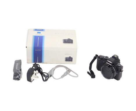 An Olympus Stylus 1 camera back, boxed, possibly lacking some contents.