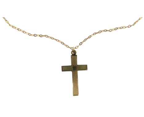 A 9ct gold crucifix pendant and chain, the crucifix with engine turned decoration, on a fine link neck chain, yellow metal ma