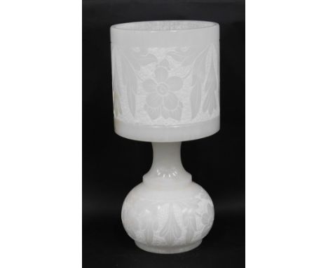 A carved alabaster table lamp with shade, decorated with flowers, 51cm high. 