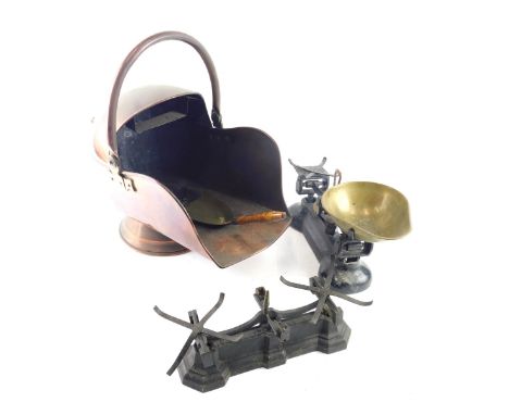 A late Victorian copper helmet shaped coal scuttle, set of scales, etc. 