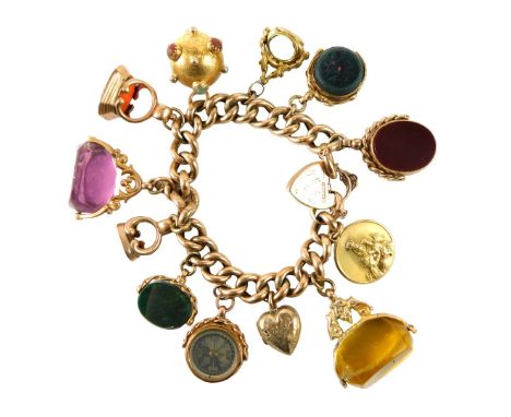 A 9ct gold charm bracelet, set with charms to include amethyst and other seals, compass, an orb set with semi precious stones