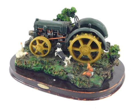 A Juliana collection painted competition sculpture, of a tractor with farmyard animals. (AF)