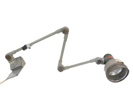 A wall mounted adjustable jeweller's lamp, with grey paint and label Luminaire Task one EOL industries Ltd Rugeley Made in th
